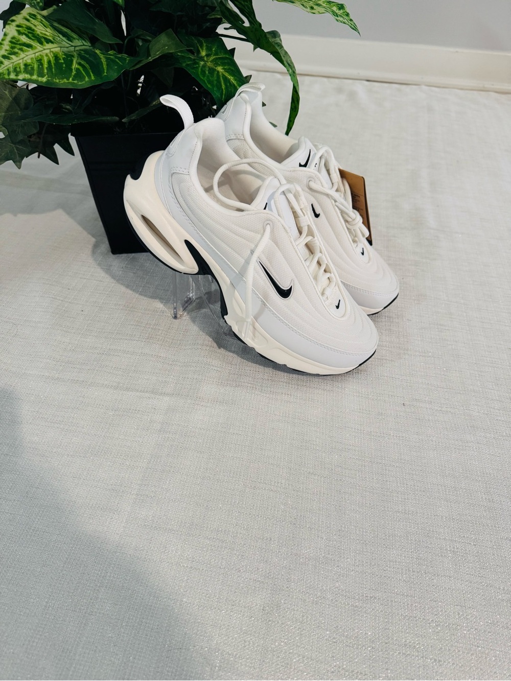 Nike White Sneakers with Black Swoosh Detailing